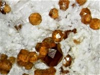 Spessartine with hyaline opal Wuhan, China 10X natural light.jpg
