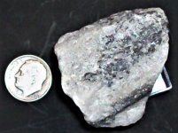 Scheelite, Mittersill Scheelite Deposit, Salzburg, Austria, US dime for scale, natural light.JPG