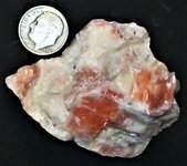 Calcite, salmon, Sterling Hill Mine, Ogdensburg, Sussex Co., NJ, US dime for scale, natural li...JPG