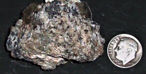 Fluorite spots, Poudrette Qy., Mont St. Hilaire, Quebec, Canada, US dime for scale, natural li...JPG